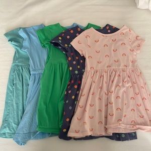 5 girls dresses: 1 cat and Jack size 4t and 4 Primary pocket dresses size 4-5